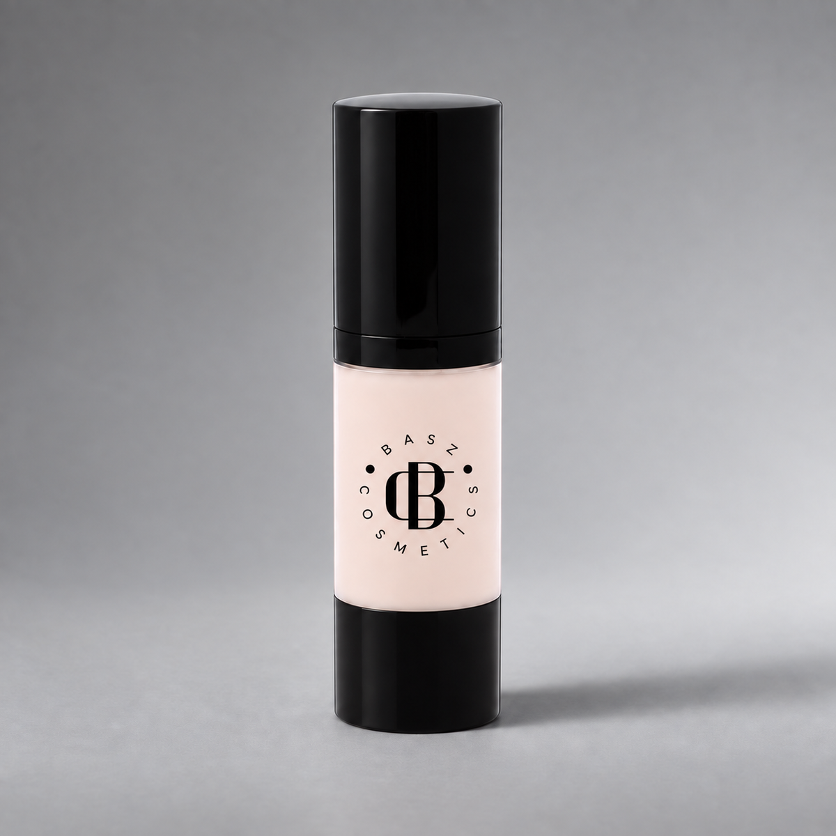 BaszCosmetics Bare It All Liquid Foundation — Porcelain Angel (100), black logo on gray studio background