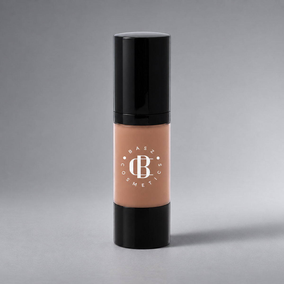 BaszCosmetics Bare It All Liquid Foundation — Tan Lines (154), white logo on gray studio background