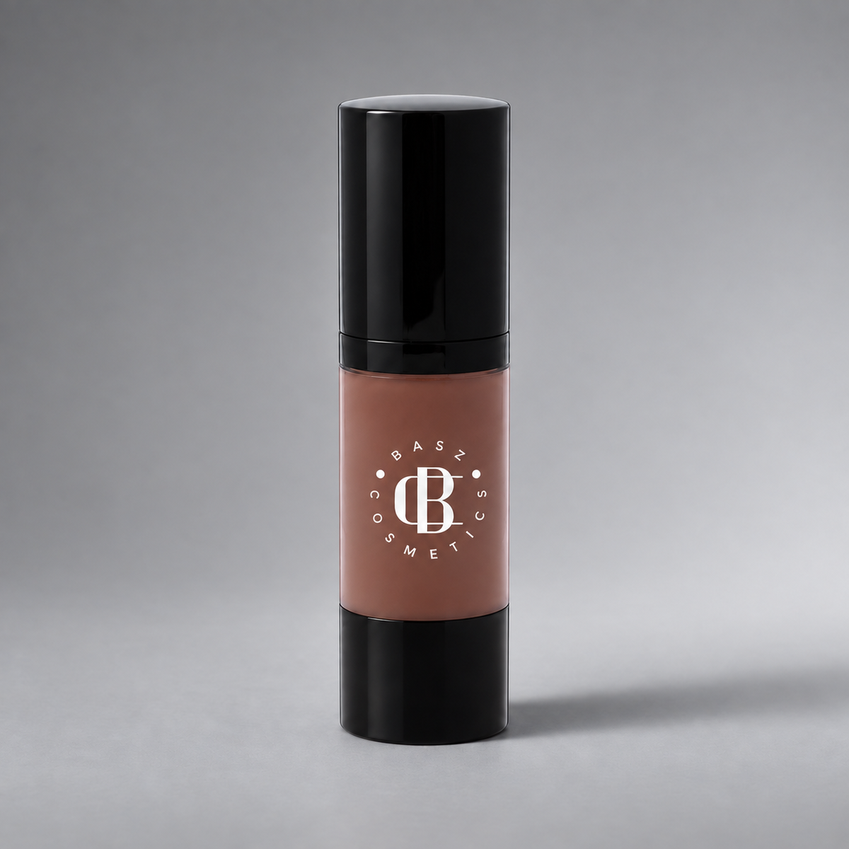 BaszCosmetics Bare It All Liquid Foundation — Ebony Empress (106), white logo on gray studio background