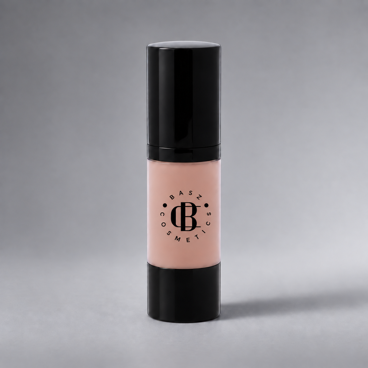 BaszCosmetics Bare It All Liquid Foundation — Porcelain Babe (112), black logo on gray studio background