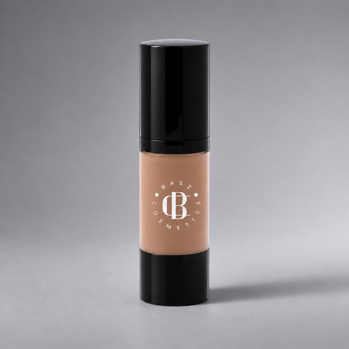 BaszCosmetics Bare It All Liquid Foundation — Tan Temptation (153), white logo on gray studio background