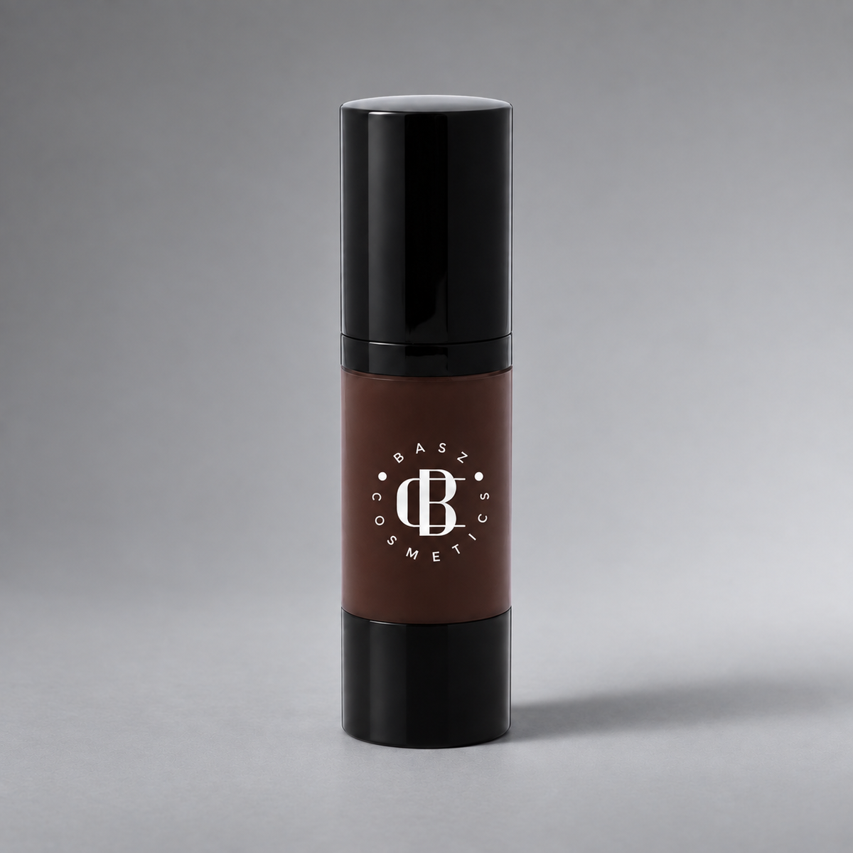 BaszCosmetics Bare It All Liquid Foundation — Espresso Energy (160), white logo on gray studio background