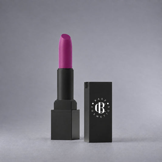 BaszCosmetics Plum Plot Lipstick — Plum Fiction, white logo on cap, gray studio background